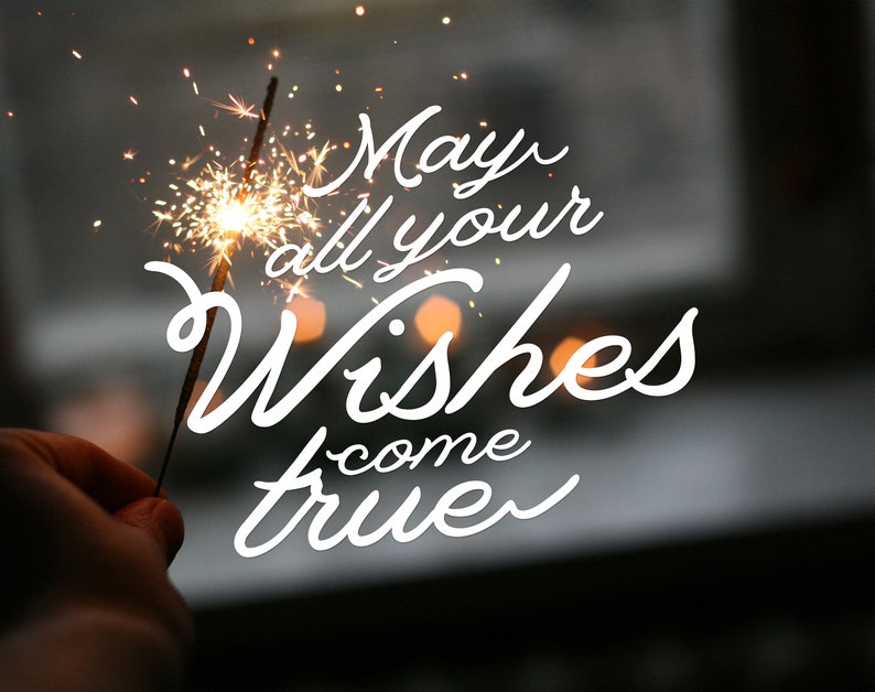 以下が含まれることがあります： 白い背景に、スパークラーと「May all your wishes come true」というテキストが書かれた画像です。