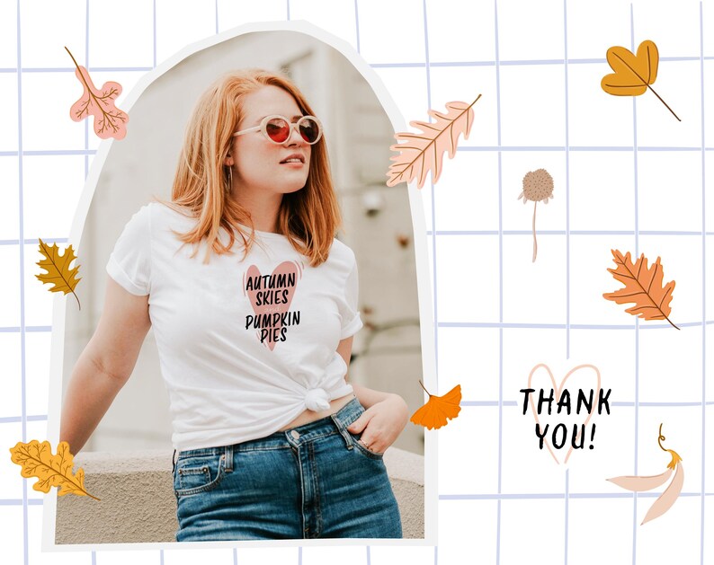 May include: White t-shirt with the text "AUTUMN SKIES PUMPKIN PIES" in a heart-shaped design. The image includes fall-themed illustrations of leaves and a "THANK YOU!" message. The person is wearing blue jeans and sunglasses.