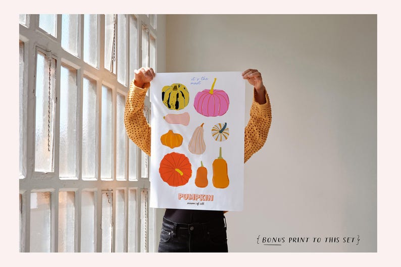 May include: A white print with colorful illustrations of different types of pumpkins. The print has the text "It's the most... Pumpkin" and "Season of all".