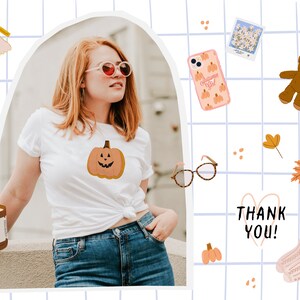 May include: A white t-shirt with a pumpkin graphic and the text "Thank You!" on a blue and white grid background. There are various fall-themed illustrations, including a teddy bear, a phone case with a pumpkin design, and a candle.