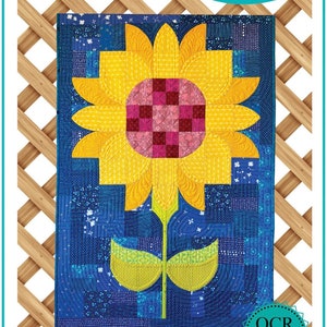 May include: A quilting pattern for a sunflower with a yellow center and green leaves on a blue background. The pattern is called "Posh Sunflower" and is a Sew Kind of Wonderful mini pattern.