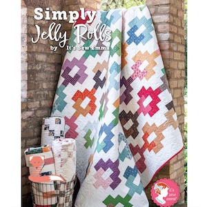 May include: A quilt pattern book titled "Simply Jelly Rolls" by It's Sew Emma. The book features a colourful quilt with a white background and a variety of bright colours, including red, orange, yellow, green, blue, purple, and pink. The quilt is made with a jelly roll of fabric.