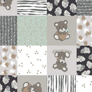 May include: A patchwork quilt with a variety of patterns, including clouds, stripes, hearts, and bears. The quilt is made in a neutral color palette of gray, white, and brown.