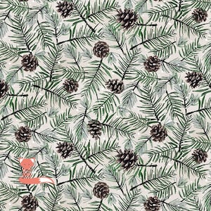 May include: A repeating pattern of green pine branches and brown pine cones on a light beige background. The design has a watercolor effect, with small white dots scattered throughout. A small fox illustration is in the lower left corner.