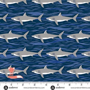 May include: Fabric with a repeating pattern of gray sharks swimming in blue water. The sharks are detailed with white bellies and fins. The background features wavy lines, creating an ocean effect. The fabric is suitable for various sewing projects.