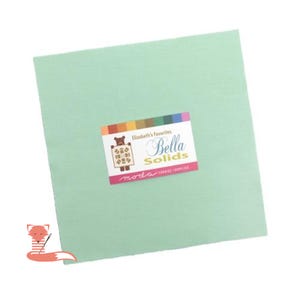 May include: A square of solid light green fabric with a label that reads "Elizabeth's Favorites Bella Solids" in white script. The label has a colorful border and the brand name "moda" in pink.