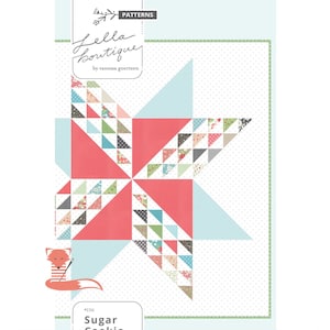 May include: A quilt pattern titled "Sugar Cookie" by Lella Boutique. The design features a star composed of red, light blue, and patterned triangles. The pattern includes a fox illustration with a needle and thread.