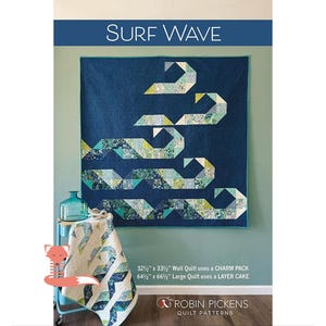 May include: A quilt pattern called "Surf Wave" featuring a blue and green wave design. The pattern is available in two sizes: 32 1/2 inches by 33 1/2 inches and 64 1/2 inches by 66 1/2 inches. The smaller quilt uses a charm pack and the larger quilt uses a layer cake.