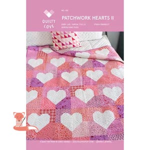 May include: A patchwork quilt with white heart shapes on a pink and purple background. The quilt is on a bed with a matching pillow. The text "PATCHWORK HEARTS II" is visible.