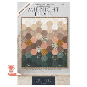 May include: A quilt pattern titled Midnight Hexie by Jessica Rose, No. 23. The cover features a quilt made of hexagonal fabric patches in a gradient of cream, tan, pink, mustard, and dark green, with floral and polka dot prints. Text includes Layer Cake Friendly, No Y Seams, Beginner Friendly, Throw Size, and Quiltd Studios.
