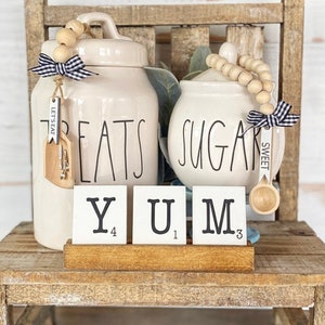Let’s Eat canister scoop, with silverware. Sugar bowl spoon, & YUM scrabble tile set with tray. Farmhouse Kitchen, tiered tray, hutch