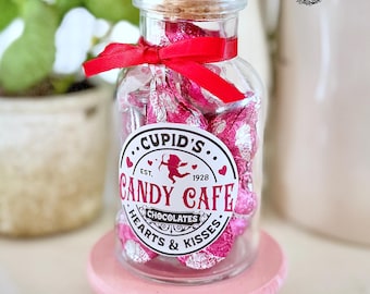 Valentines Day Candy Jar - does not come with any candy.  Comes with ribbon, cork lid and label on the glass jar 4.25 x 2.25 inch