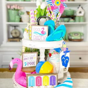 Pool party themed tiered tray set! Mix and match items, bright colors, garlands, neon, 3D signs picket fence etc P16