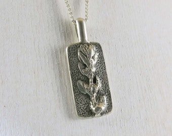 Pendentif en argent sterling oxydé à motif de plante