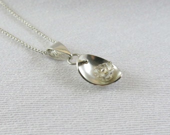 Sterling silver pendant, delicate flower in a dome