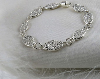 Sterling silver bracelet with textured ovals