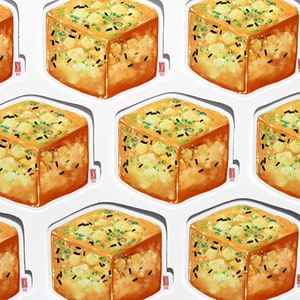 May include: A sheet of stickers featuring a repeating pattern of a cube-shaped food item. The food is golden brown with green and black toppings, and is presented on a white background. Each sticker has a small red stamp.