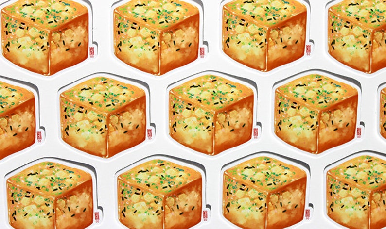 May include: A sheet of stickers featuring a repeating pattern of a cube-shaped food item. The food is golden brown with green and black toppings, and is presented on a white background. Each sticker has a small red stamp.