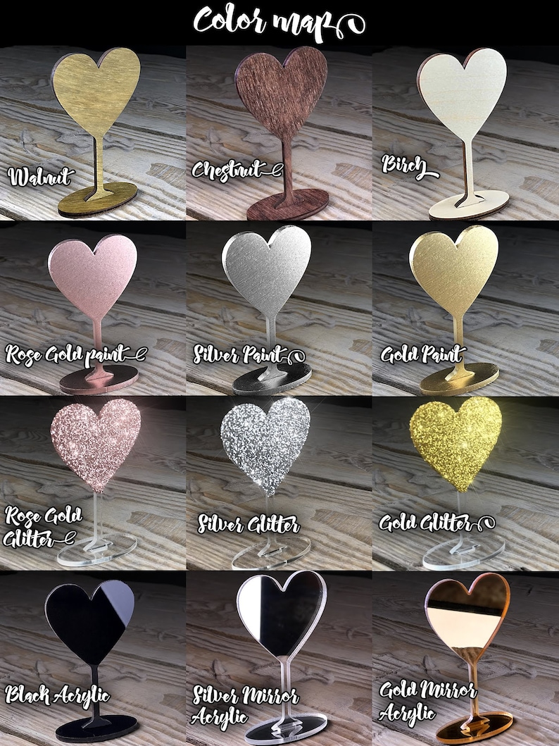 May include: Color chart showing different finishes for heart-shaped acrylic place card holders. Options include walnut, chestnut, birch, rose gold paint, silver paint, gold paint, rose gold glitter, silver glitter, gold glitter, black acrylic, silver mirror acrylic, and gold mirror acrylic.