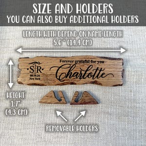 May include: A wooden sign with the text "Forever grateful for you Charlotte" and "STR 08.10.24 New York" engraved on it. The sign is 5.6 inches (14.4 cm) long and 1.7 inches (4.3 cm) high. It comes with two removable wooden holders.