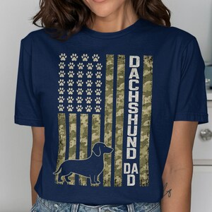 Dachshund dad dark navy t-shirt with distressed American flag and paw print design.