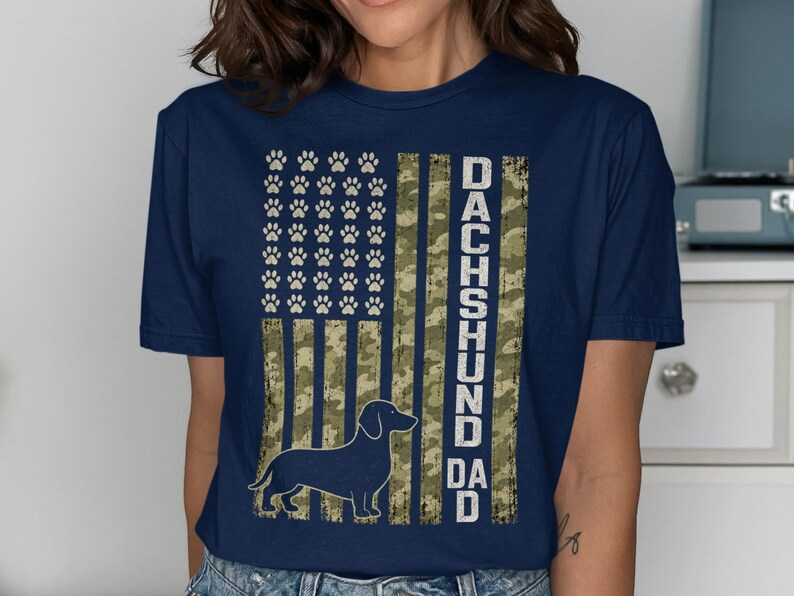 Dachshund dad dark navy t-shirt with distressed American flag and paw print design.