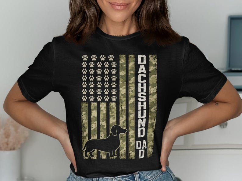 Black t-shirt with American flag design featuring paw prints and a dachshund silhouette.