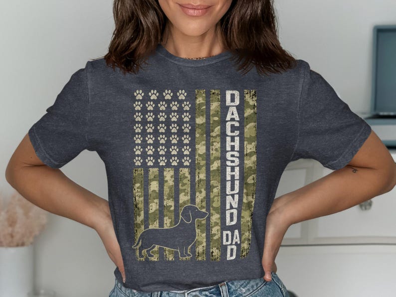T-shirt with American flag design featuring paw prints and a dachshund silhouette.