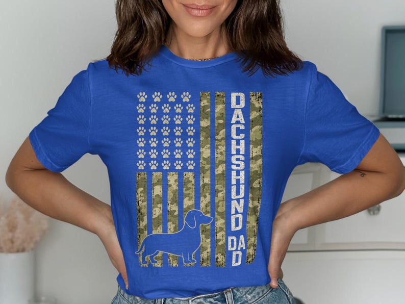 Blue shirt with a Dachshund silhouette and "Dachshund Dad" text on a flag design.
