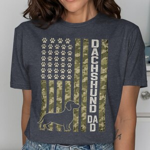 Dachshund dad text with paw print flag and silhouette of a dachshund.