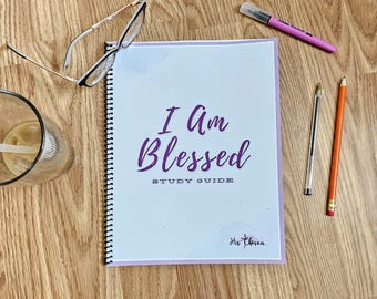 May include: A purple and white spiral bound study guide with the text "I Am Blessed Study Guide" and the logo "His Chosen" on the cover.