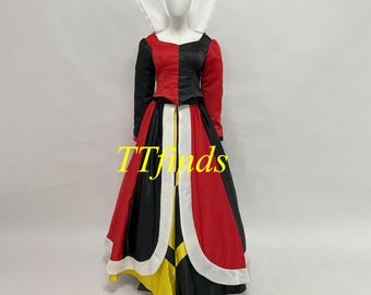 May include: A Queen of Hearts costume with a black, red, and white color scheme. The bodice is split, with one side black and the other red. The skirt is a full, flowing design with alternating panels of black and red, trimmed with white. A white collar completes the look.