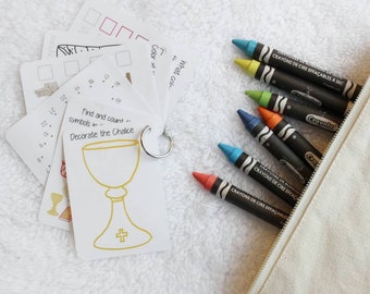 May include: A set of white flashcards with religious-themed illustrations and prompts, held together by a metal ring. Crayola crayons in various colors are in a beige zippered pouch. The flashcards feature a chalice illustration.