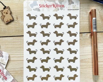 Peut inclure: Une feuille de 30 autocollants de dachshund marrons sur fond blanc. Les autocollants sont disposés en 5 rangées de 6. La feuille est étiquetée "Sticker Kitten" et "Dachshund Stickers".