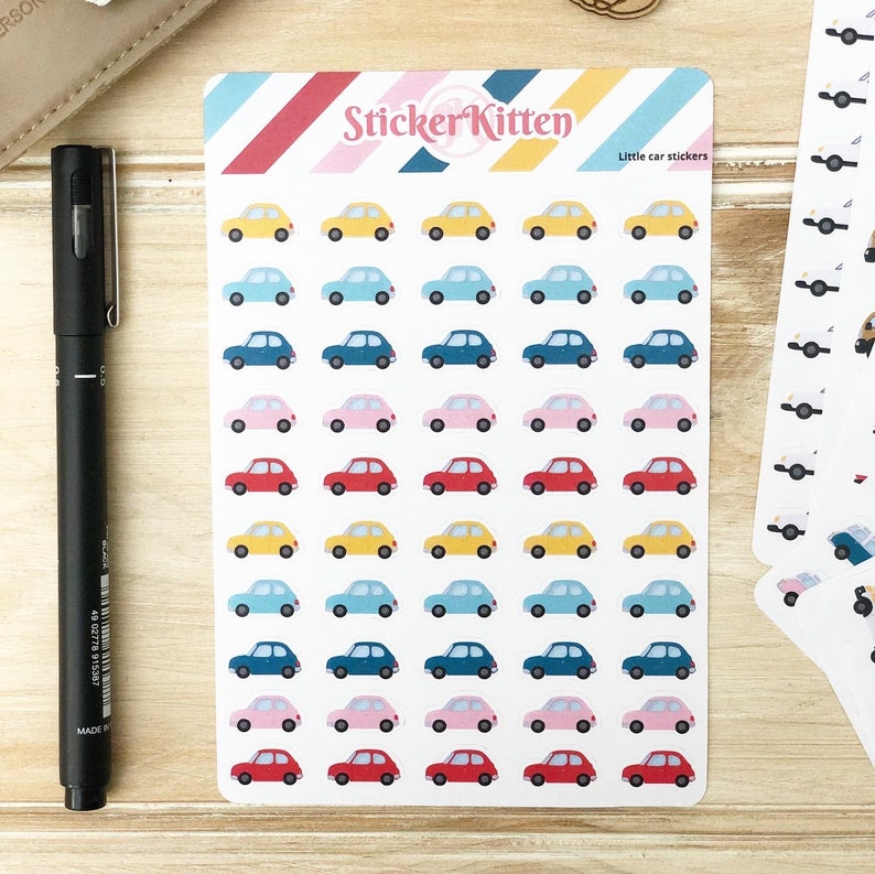 May include: A sheet of stickers featuring small, colorful cars in various shades of blue, yellow, pink, and red. The stickers are arranged in rows and columns on a white background. The sheet is labeled "Sticker Kitten" and "Little car stickers".