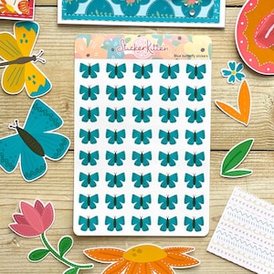 May include: A sheet of blue butterfly stickers with the text "Sticker Kitten" and "Blue butterfly stickers".