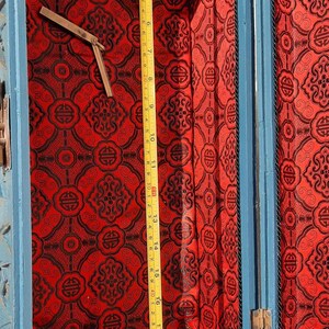 May include: A blue wooden box with a red and black patterned lining. The box is open and the lid is propped up. The box is about 20 inches long.