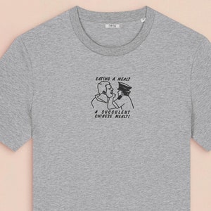 An embroidered light grey t-shirt design of the Australian Jack Karlson being arrested while he shouts Eating A Meal? A Succulent Chinese Meal?!