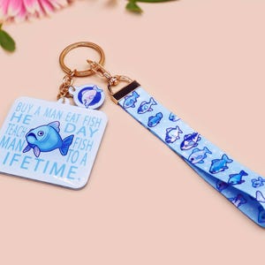 Buy A Man Eat Fish Lanyard Keychain: Funny Meme Fish Lover Gift
