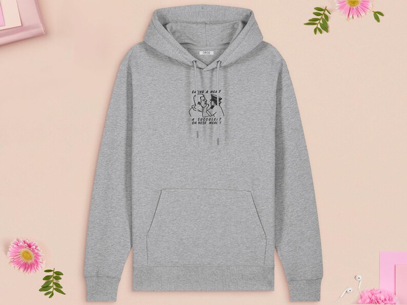 An embroidered light grey hoodie design of the Australian Jack Karlson being arrested while he shouts Eating A Meal? A Succulent Chinese Meal?!