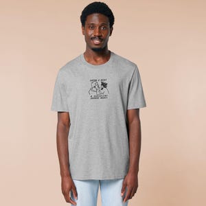 An embroidered light grey t-shirt design of the Australian Jack Karlson being arrested while he shouts Eating A Meal? A Succulent Chinese Meal?!