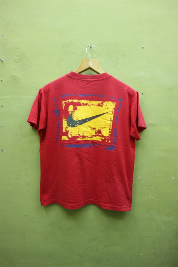 red and green nike shirt