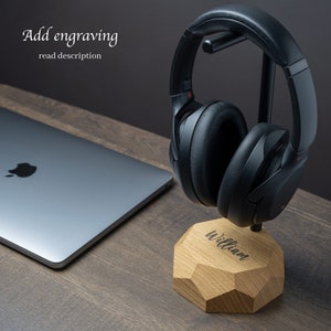 May include: A black headphone stand with a wooden base. The base is engraved with the name "William".