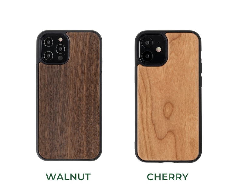 May include: Two phone cases made of wood. The case on the left is walnut wood and the case on the right is cherry wood.