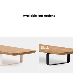 May include: Two wooden tabletops with different leg options. The tabletop on the left has white legs and the tabletop on the right has black legs. The text "White" is above the tabletop on the left and the text "Black" is above the tabletop on the right.