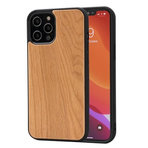 May include: A wood-grain phone case with a black border. The case is designed for an iPhone with a triple camera lens. The phone case is shown with a black phone inside.