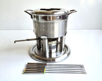 Juego de fondue Farberware vintage de acero inoxidable con soporte de metal, tenedores y bandeja, 11 piezas.