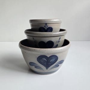 3 vintage Rowe Pottery salt glaze nesting mixing bowls with blue heart design