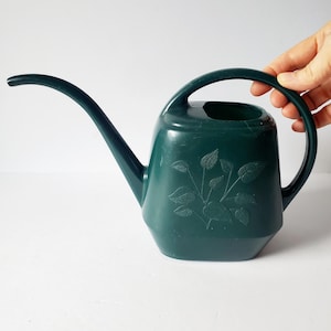 vintage green plastic indoor watering can
