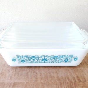 May include: White casserole dish with a blue and white patterned design. The dish has a lid.
